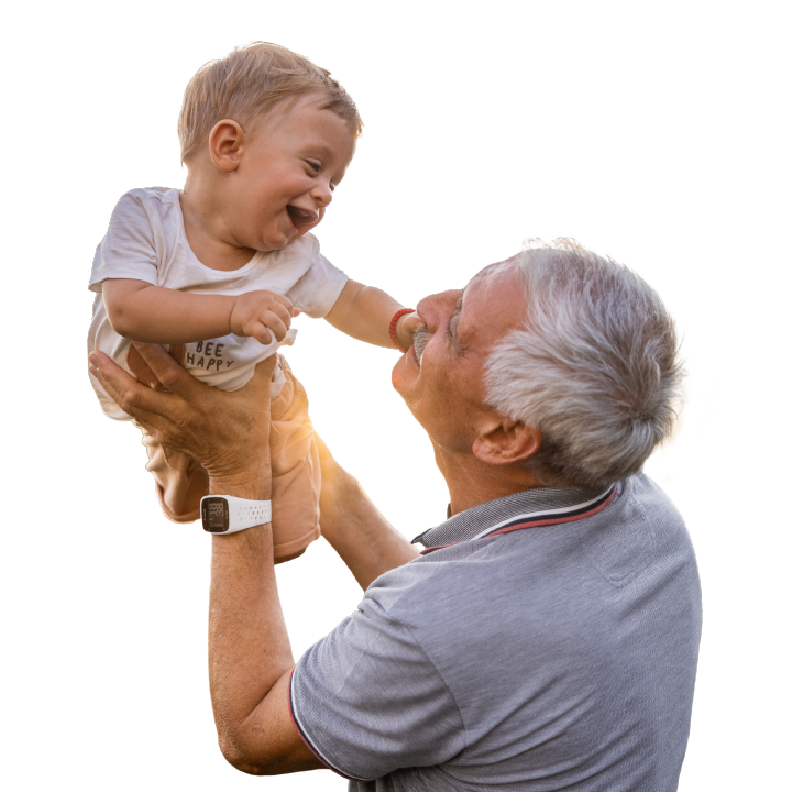 grandpa raising his grandson in the air